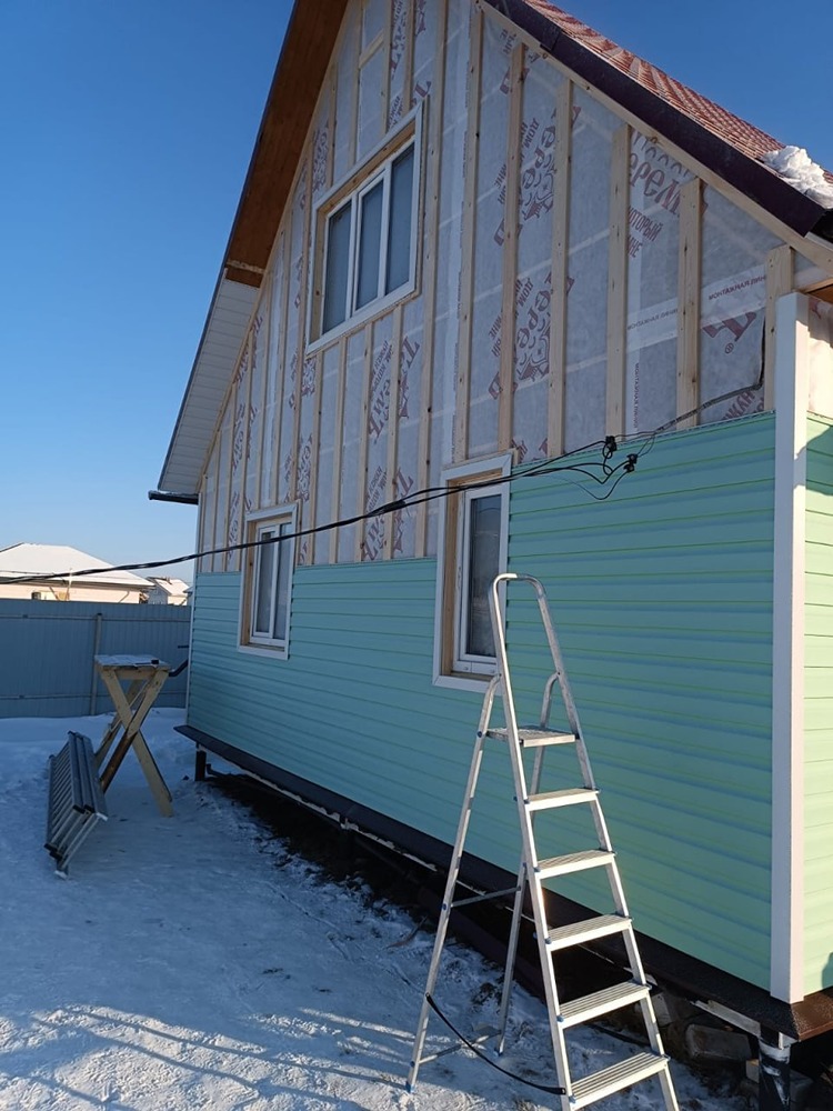 Обшивка сайдингом деревянного дома